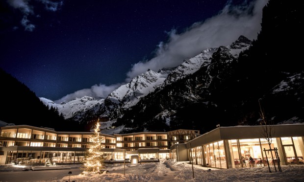 Exterior view of the Hotel Feuerstein in winter and at night