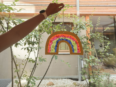 A homemade rainbow hanging in the window, glowing beautifully.