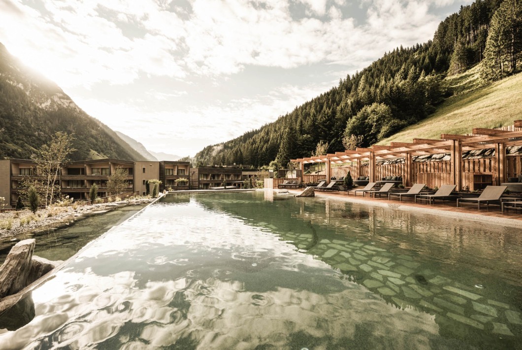 New addition to our wellness programme: heated swimming lake with views of the mountains and hotel