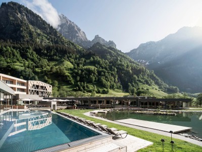 Garden view of the Feuerstein Nature Family Resort with natural swimming pond and outdoor pool