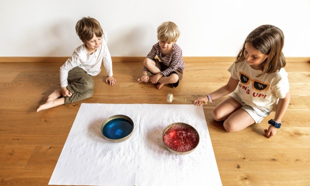 Children experiment with colors and singing bowls during the Family Relax session.