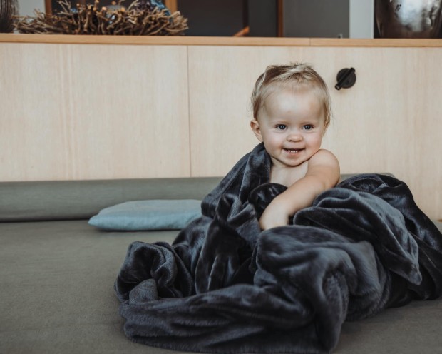 Small child wrapped in a blanket