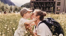Children with mother in a flower meadow