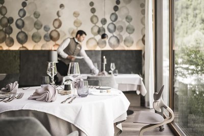 Dinner time at the restaurant of the family hotel Feuerstein in South Tyrol