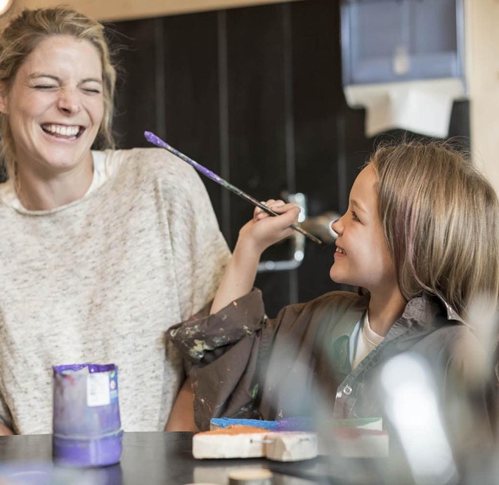 Mother & daughter in wood workshop