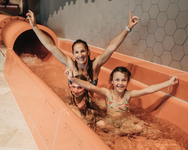 Fun on the giant speed slide with professional stopwatch at the family spa hotel Feuerstein in South Tyrol