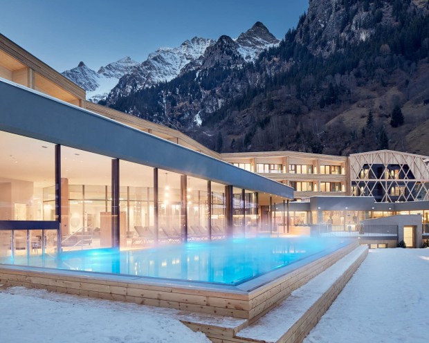 The outdoor infinity pool of the family spa hotel Feuerstein in South Tyrol