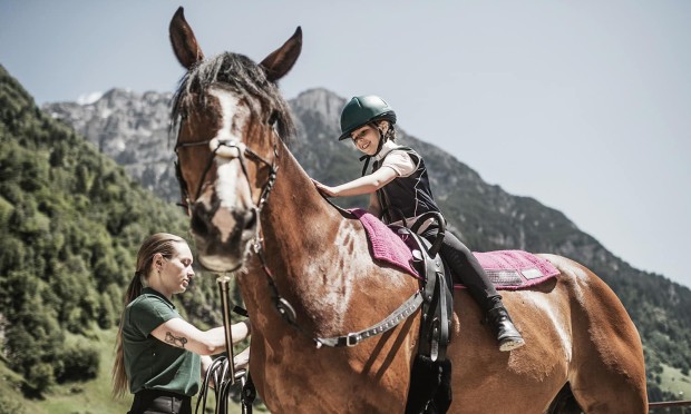 Horse-riding lessons at the equestrian centre of the Feuerstein horse riding resort in South Tyrol