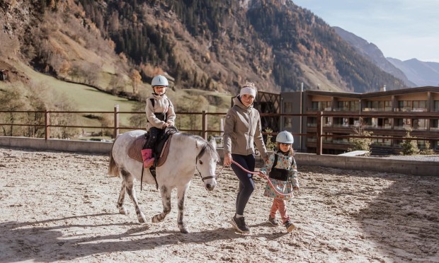 Pony rides at the equestrian centre of the Feuerstein horse riding resort in South Tyrol