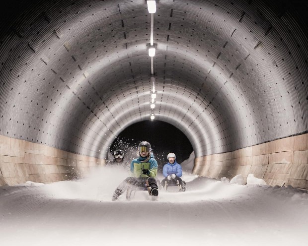 Night tobogganing near the Feuerstein family hotel, the ideal place for a family holiday in the mountains